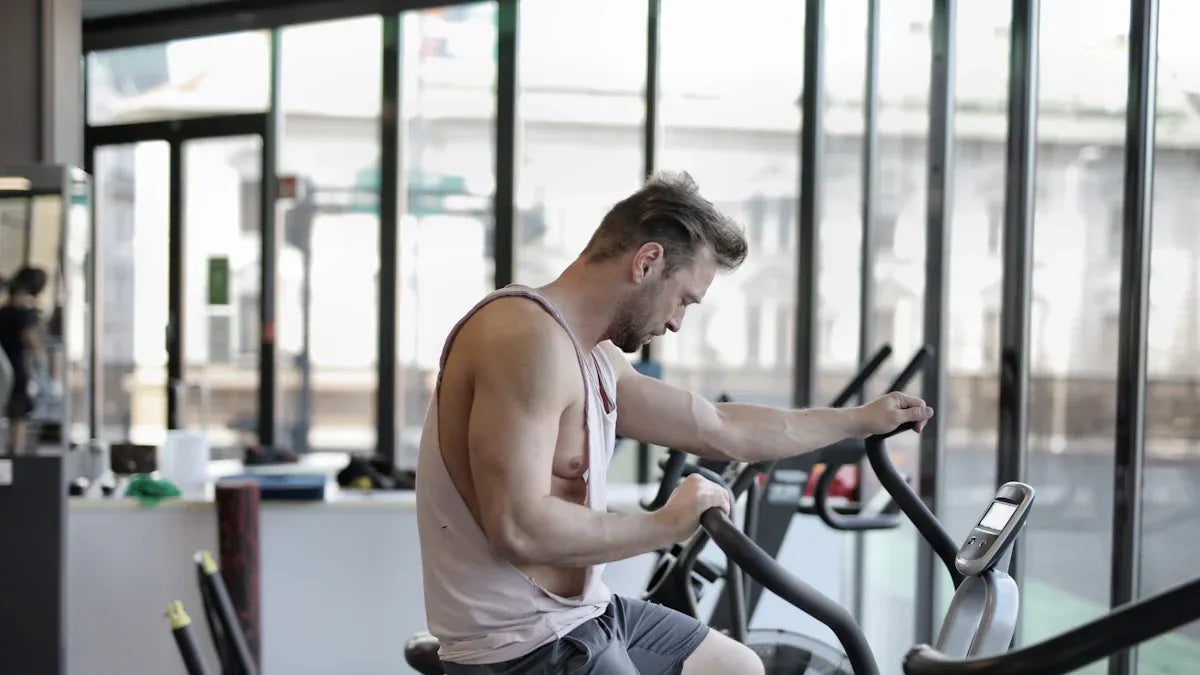 a man is riding a exercise bike in a gym
