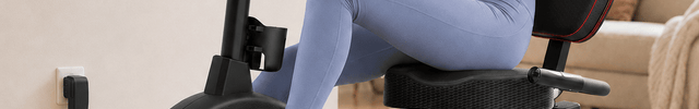 Woman exercising on a Vanswe RB607 electric recumbent exercise bike in a home setting